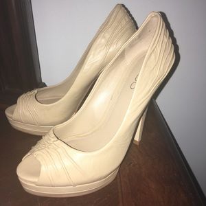 Beige open toe pumps